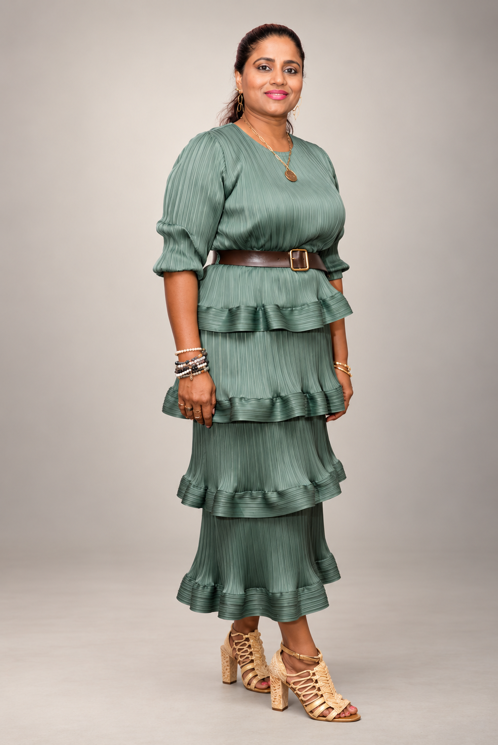 Portrait of Kohila Sivas in a green dress